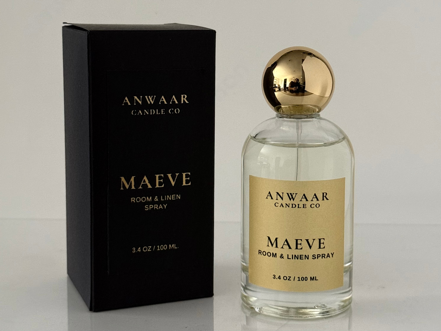 Anwaar Maeve room and linen spray bottle and packaging on a light gray background