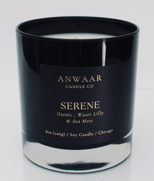 Serene - black elegant candle vessel with black label and gold letters with details about the product