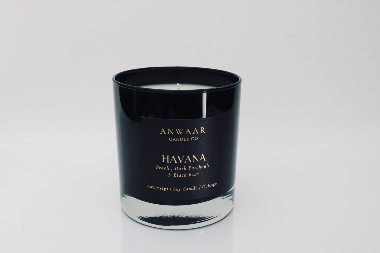 Havana- black elegant candle vessel with black label and gold letters with details about the product