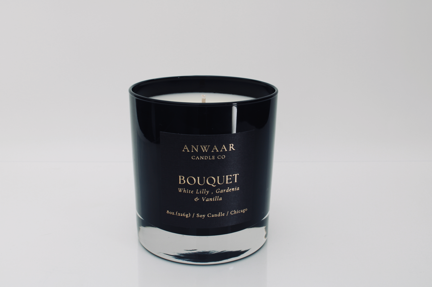 Bouquet- black elegant candle vessel with black label and gold letters with details about the product Edit alt text