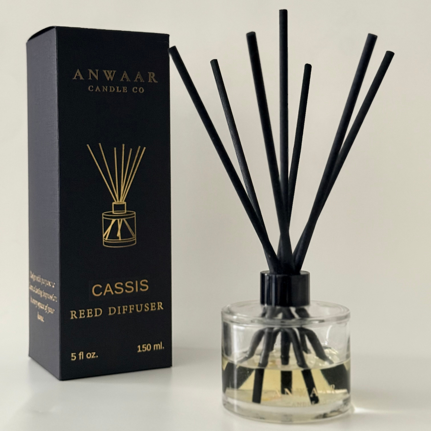 Anwaar Candle Co. Cassis Reed Diffuser with packaging on a light gray background