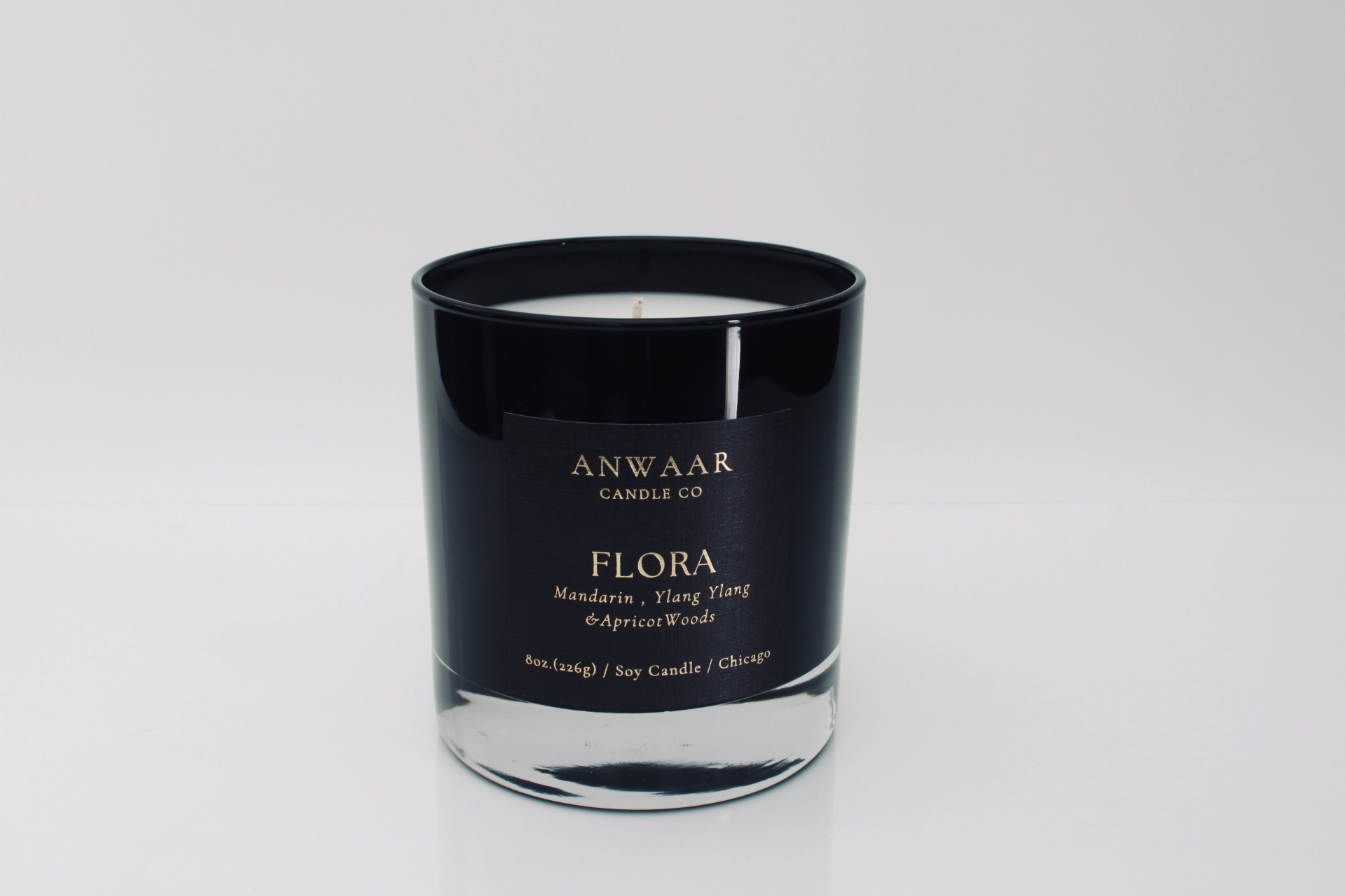 Flora - black elegant candle vessel with black label and gold letters with details about the product Edit alt text Edit alt text  Edit alt text